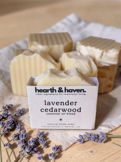 Hearth & Haven lavender cedarwood handcrafted soap bar with fresh lavender stems on linen and wood